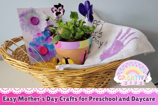 Basket filled with handmade Mother’s Day gifts from preschoolers, including a card, tea towel, pot, and necklace.